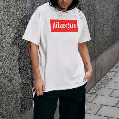 Red and white 'Filastin' on off-black oversized tee